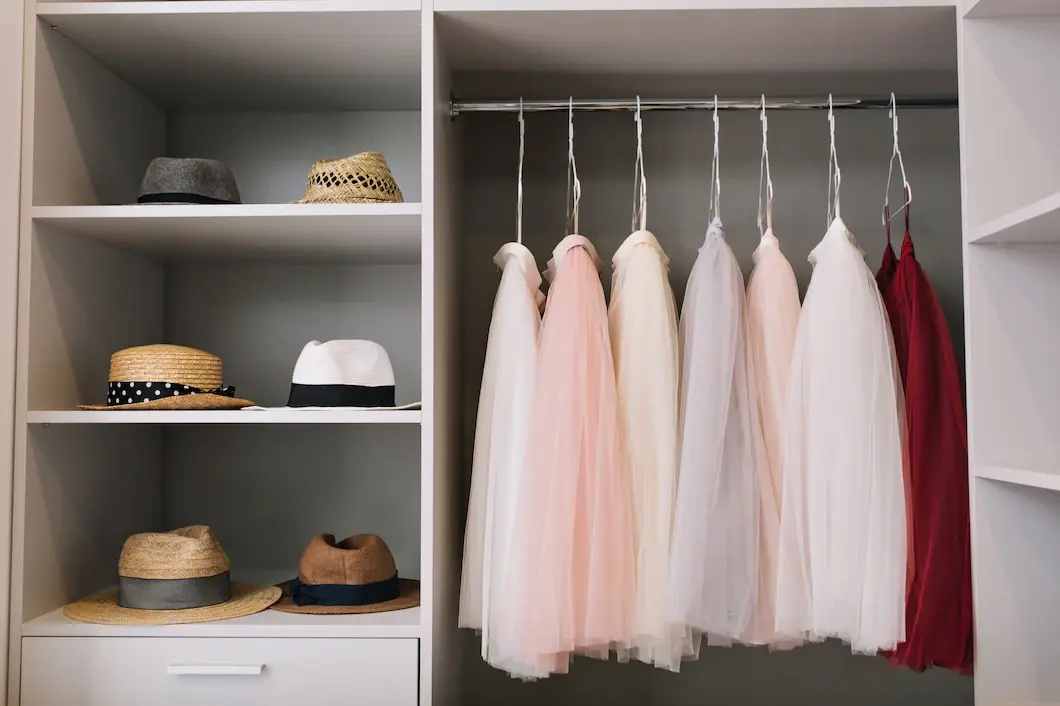 modern-bright-dressing-room-with-shelves-fashionable-hats-beautiful-pink-red-dresses-hanging-wardrobe_197531-1668 (1)